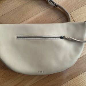 Able Cream Crossbody Bag with Curved Shape and Minimalist Design